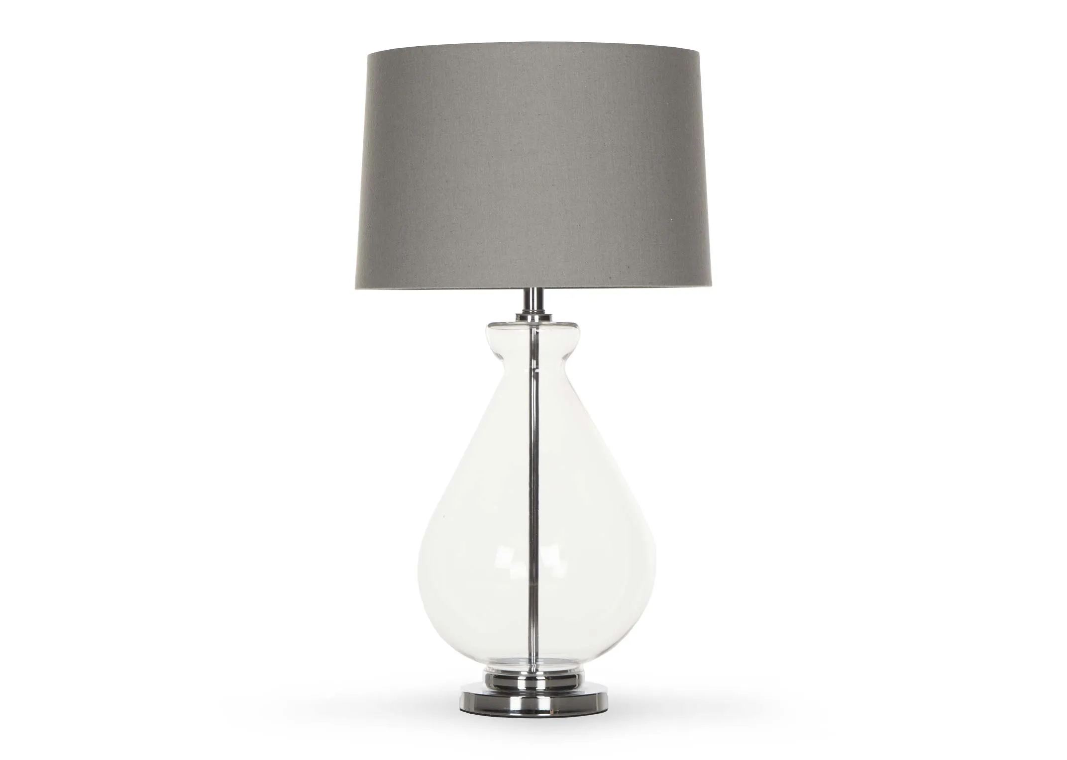 A clear based table lamp with silver fittings & grey barrel shade from EZ Living Furnitures Bree range. Front view of lamp.