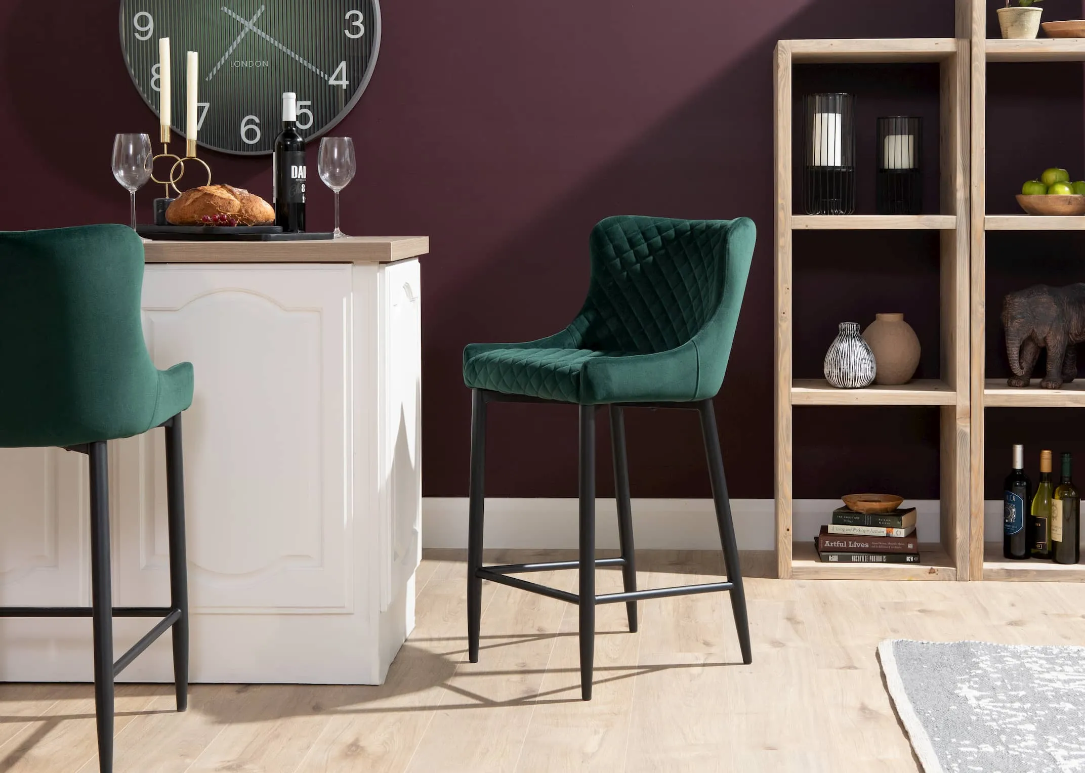 A lifestyle image of the Ottowa Green Counter Bar Stools in a kitchen setting with Cube displays.