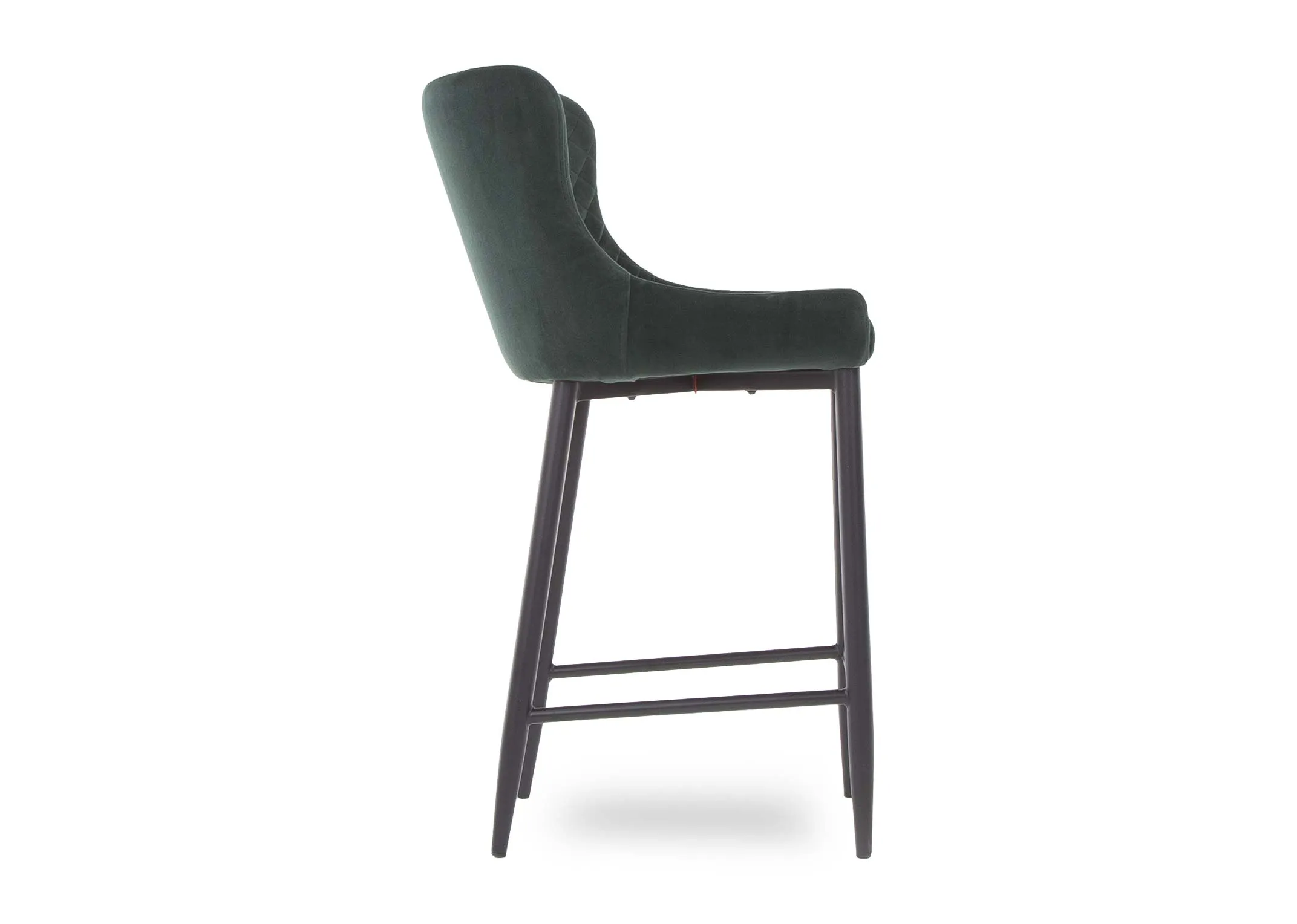 A counter bar stool with green cushioned velvet from EZ Living Furniture's Ottowa. Side view of black metal legs & footrest.