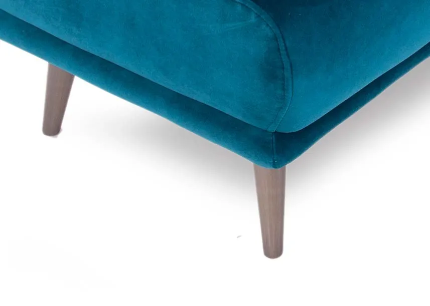 A teal velvet large footstool with wood legs from EZ Living Furniture's Katie range. Closeup pf oak wood leg