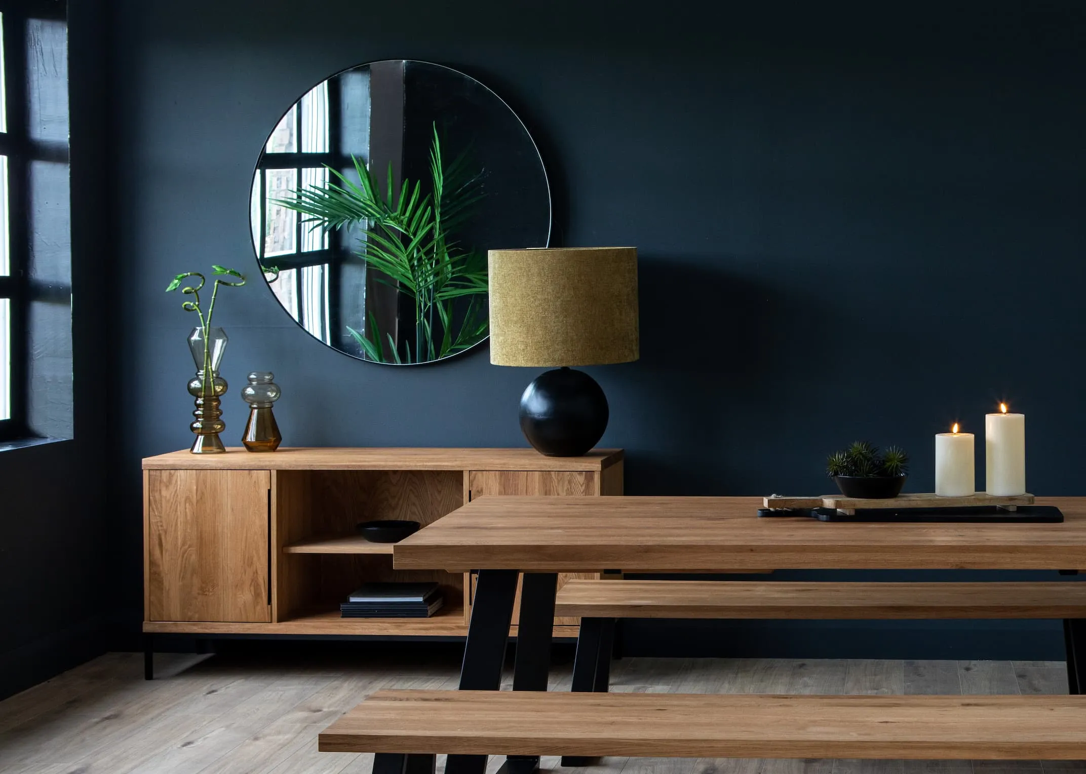 A lifestyle image of the Renvyle Dining Range with the Ebula lamp & elling mirror.