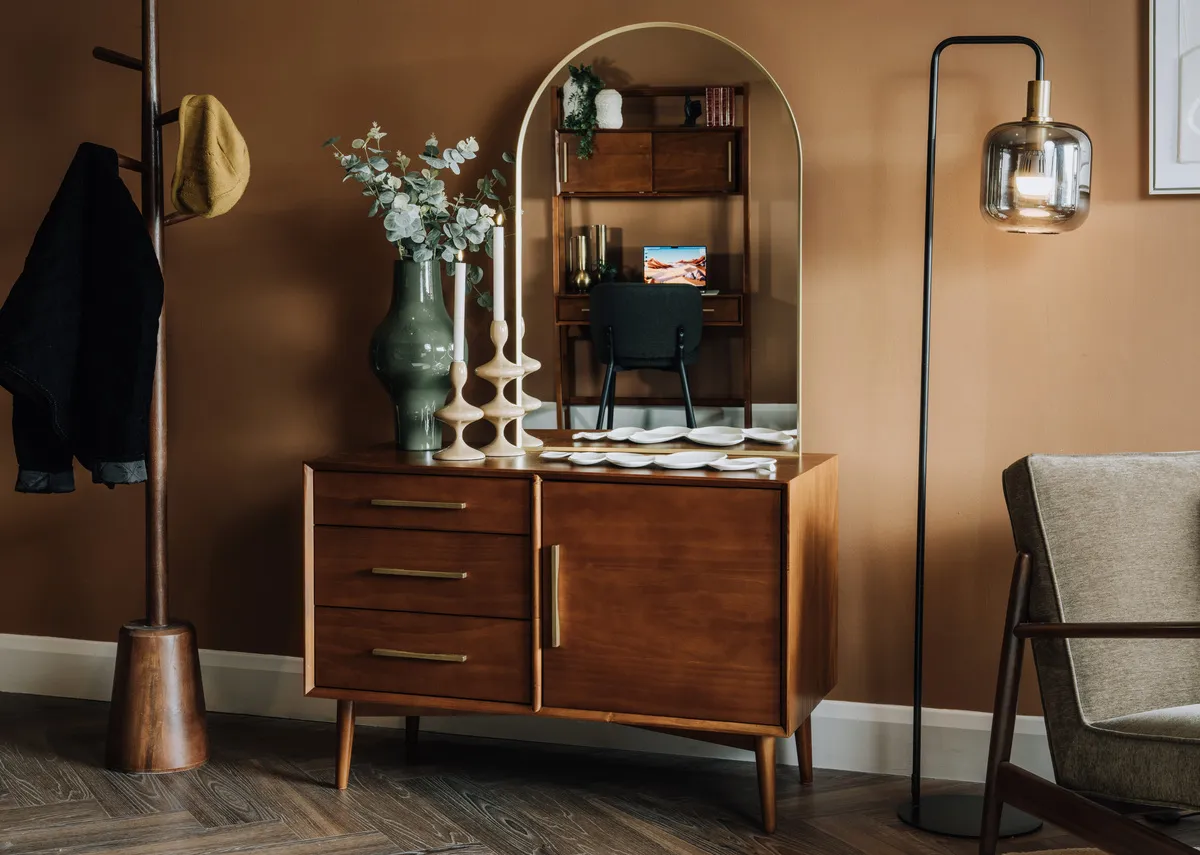 A lifestyle image of the Lekar floor lamp with Leya sideboard and Flynn gold mirror