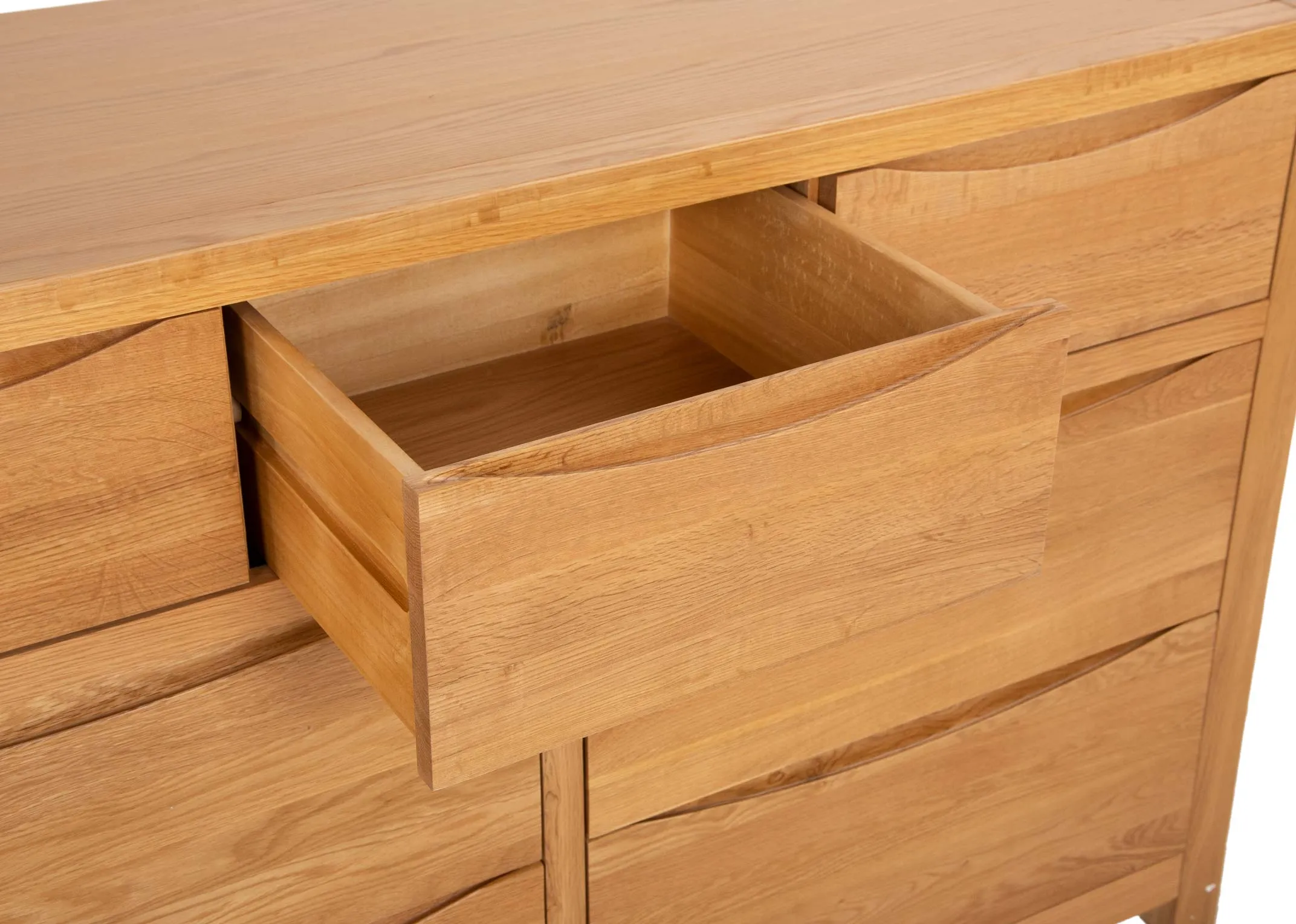 An oak chest of 7 drawers from EZ Livings Iris range. Closeup of soft close small drawer.