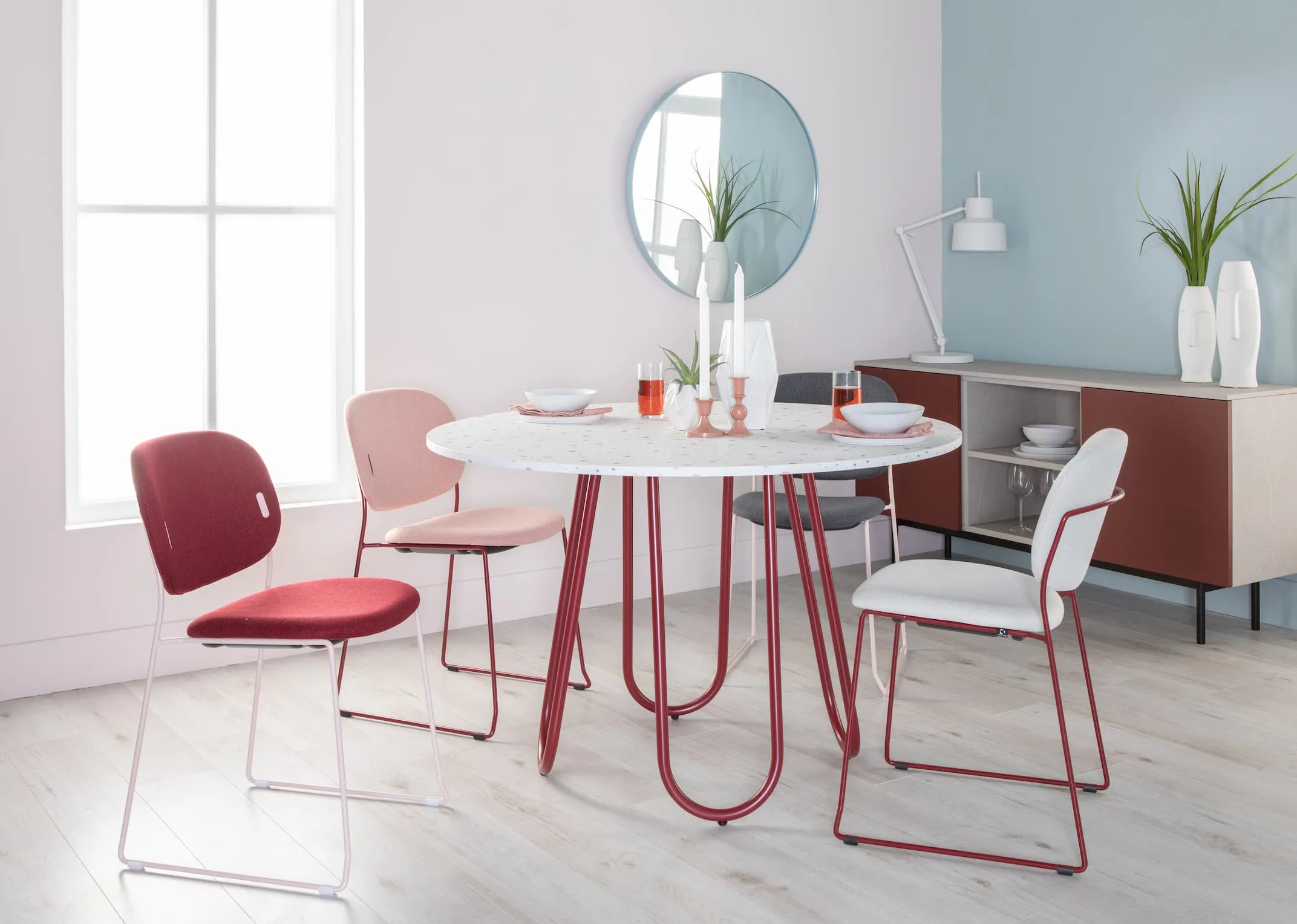 A lifebstyle image of the Trippier Candleholder on top of the Stulle Dining Table with Yo dining chairs & made sideboard