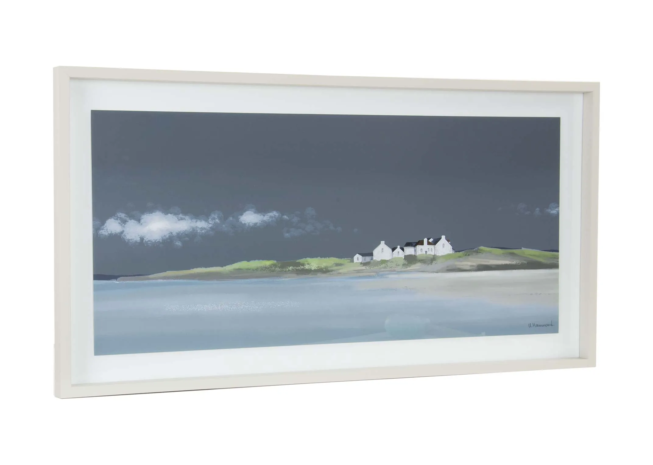 A white framed print of a house on the coast from Ulyana Hammond's True Blue range. Angled view