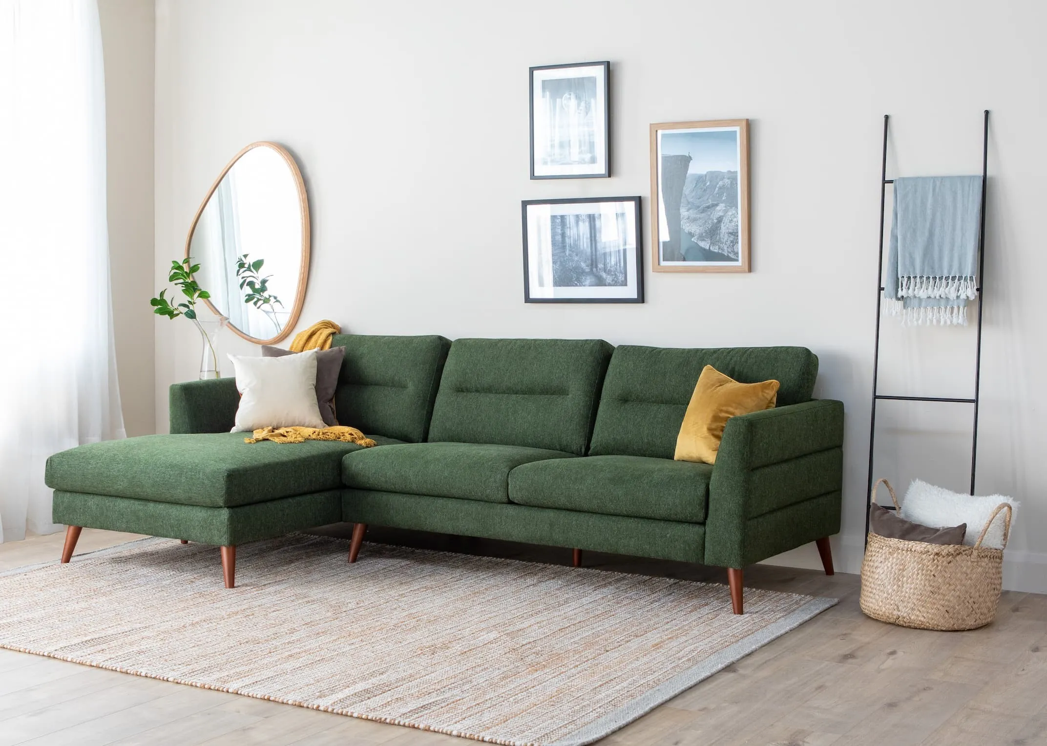 A lifestyle image of the Presley Corner Chaise with Shard tables & siem ladder with cody mirror