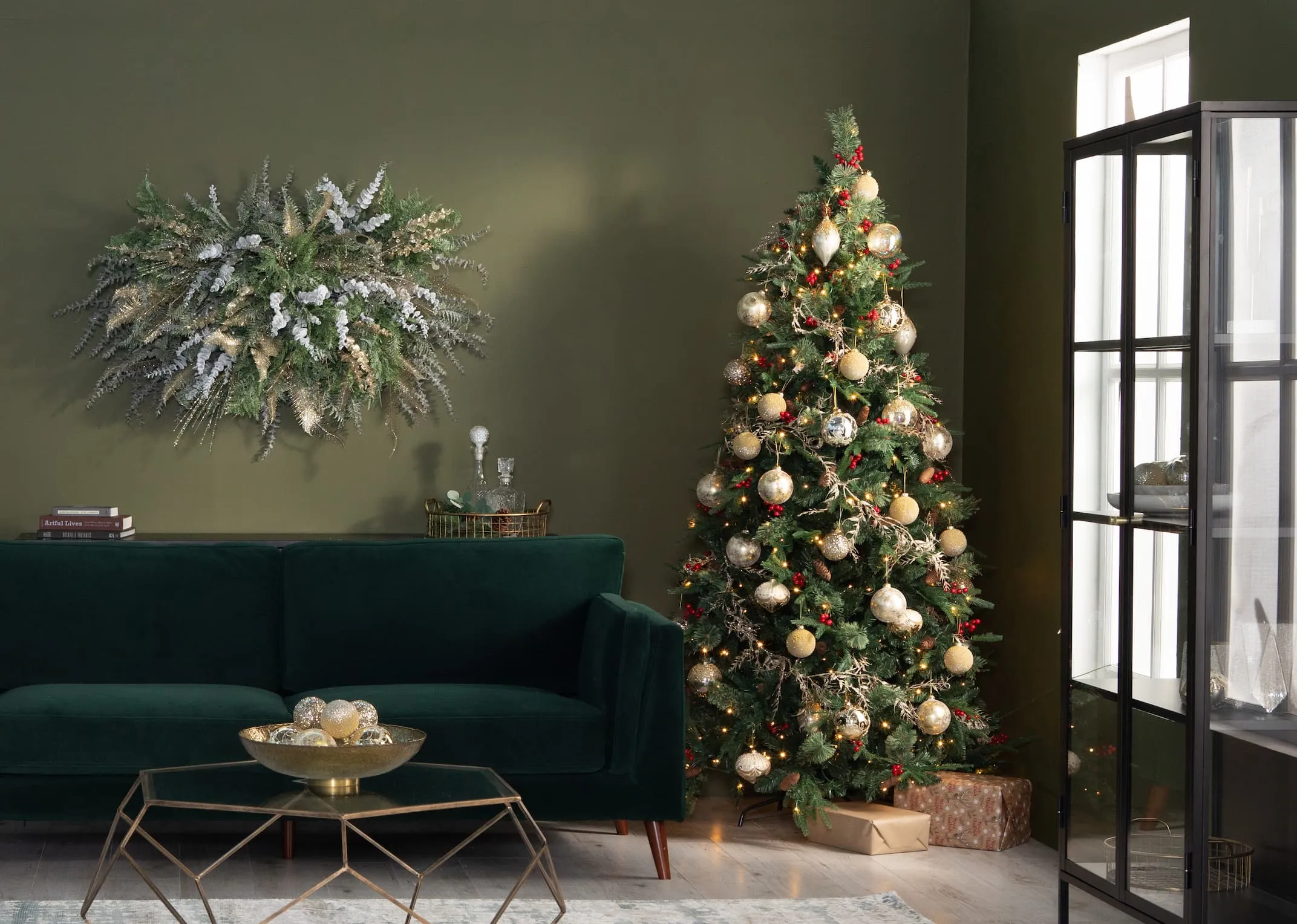 A lifestyle image of the Vermont lit trees with Bellini Green sofa & gold themed decor.