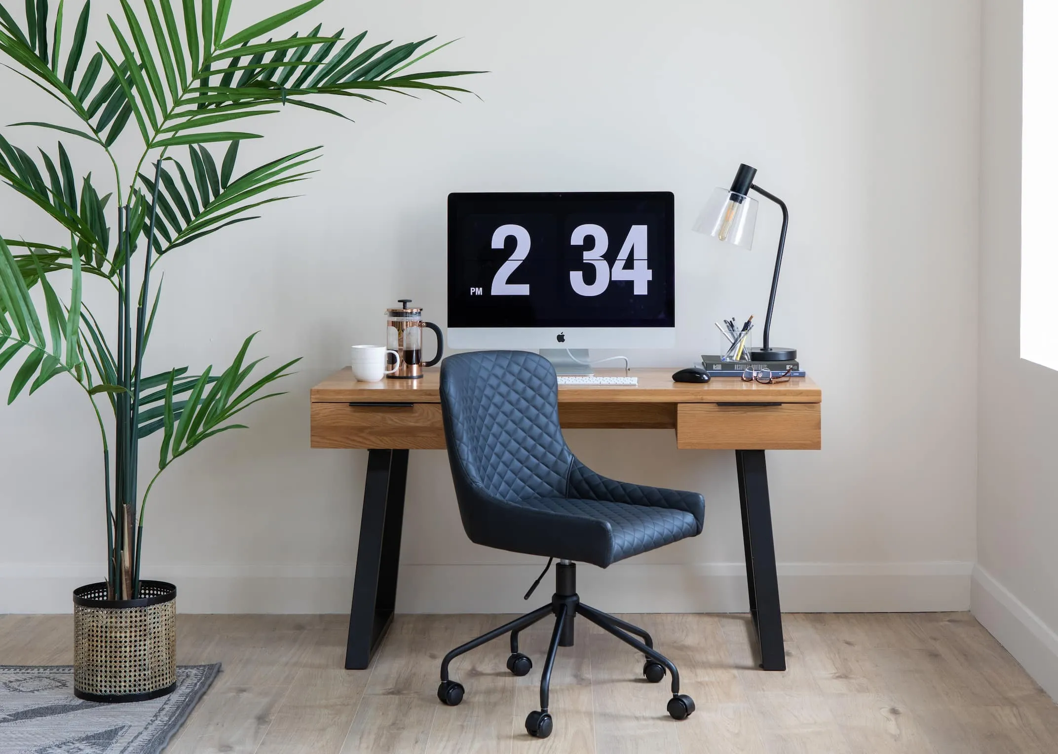 A lifestyle image of the Mila desk with chicago lamp & Ottowa black pu office chair.