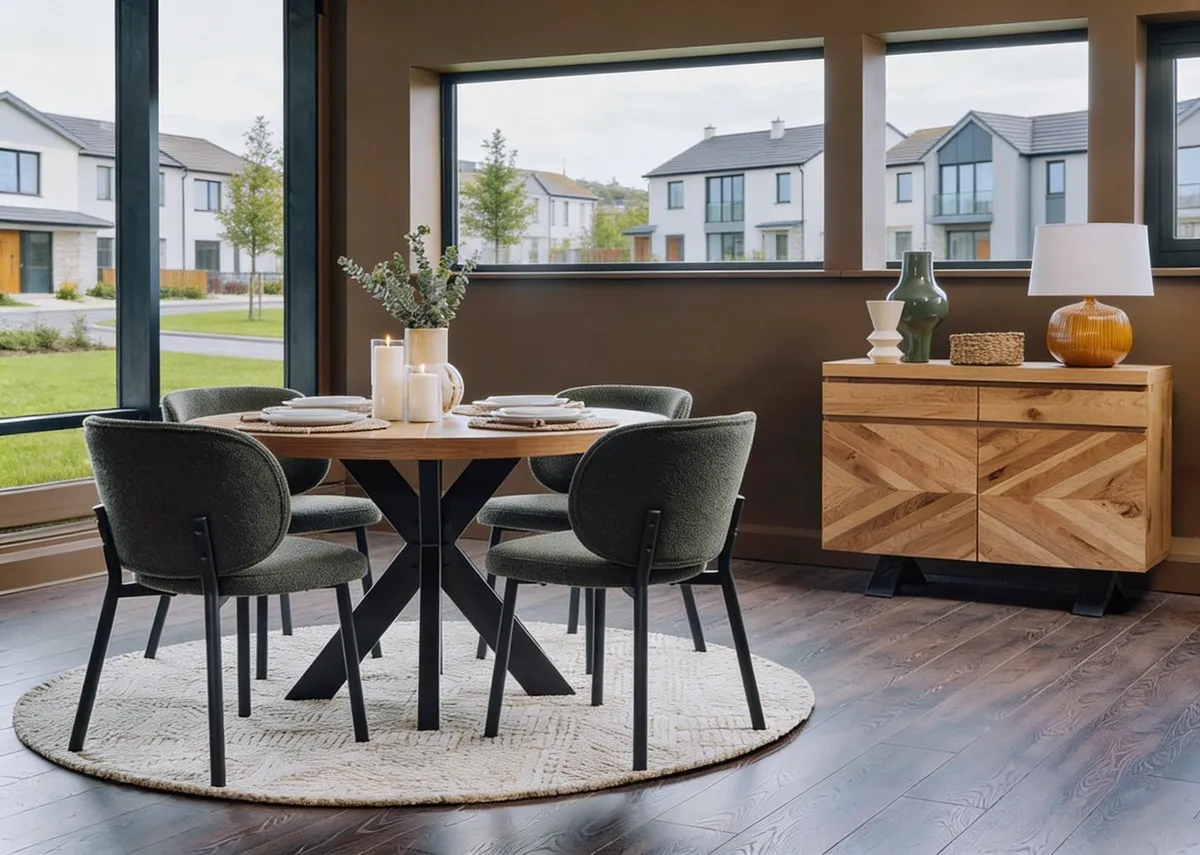 A lifestyle image of the Ellipse dining table with swan chairs