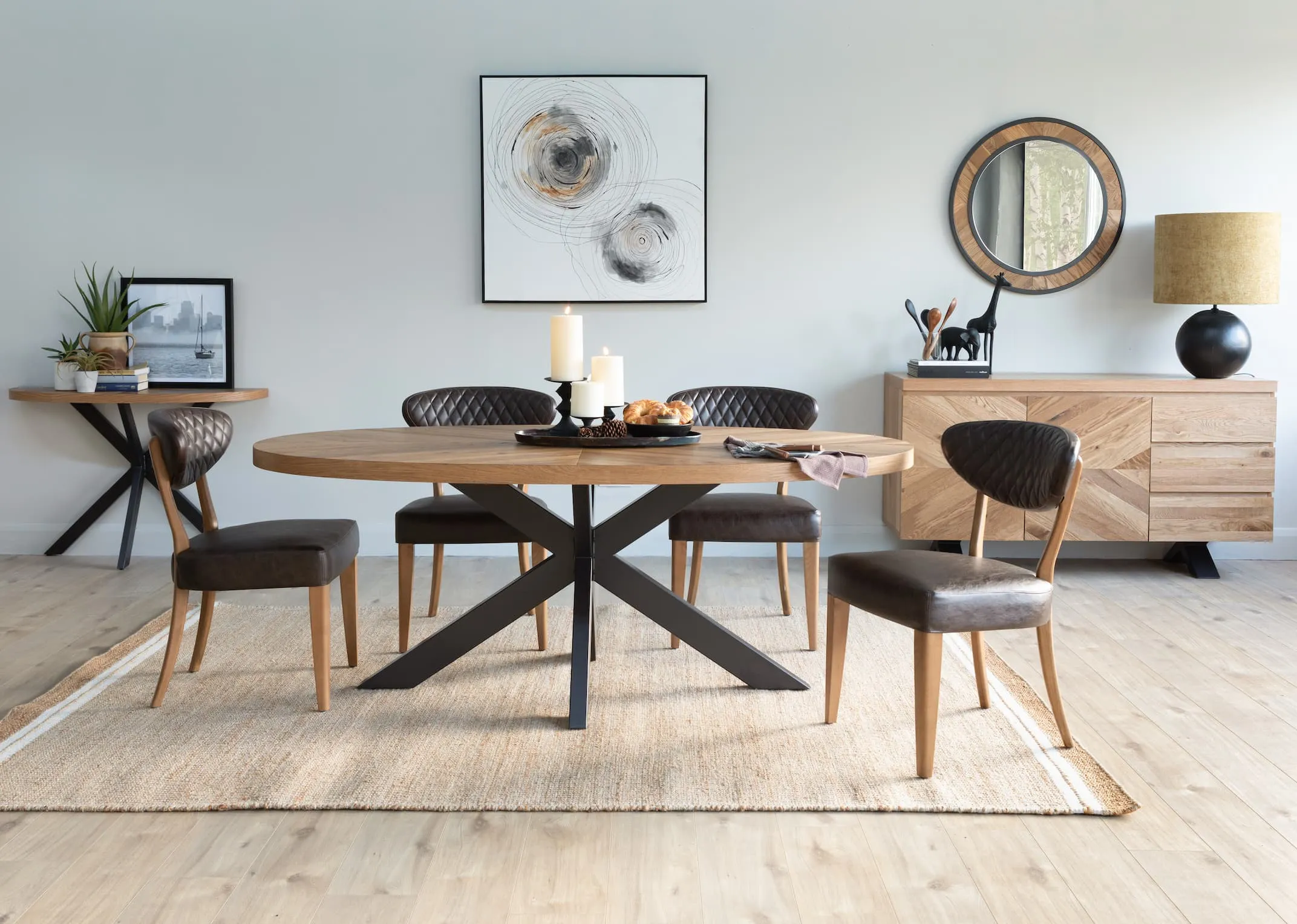 A lifestyle image of the Margot dining chairs with the ellipse dining range& novato oyster rug.