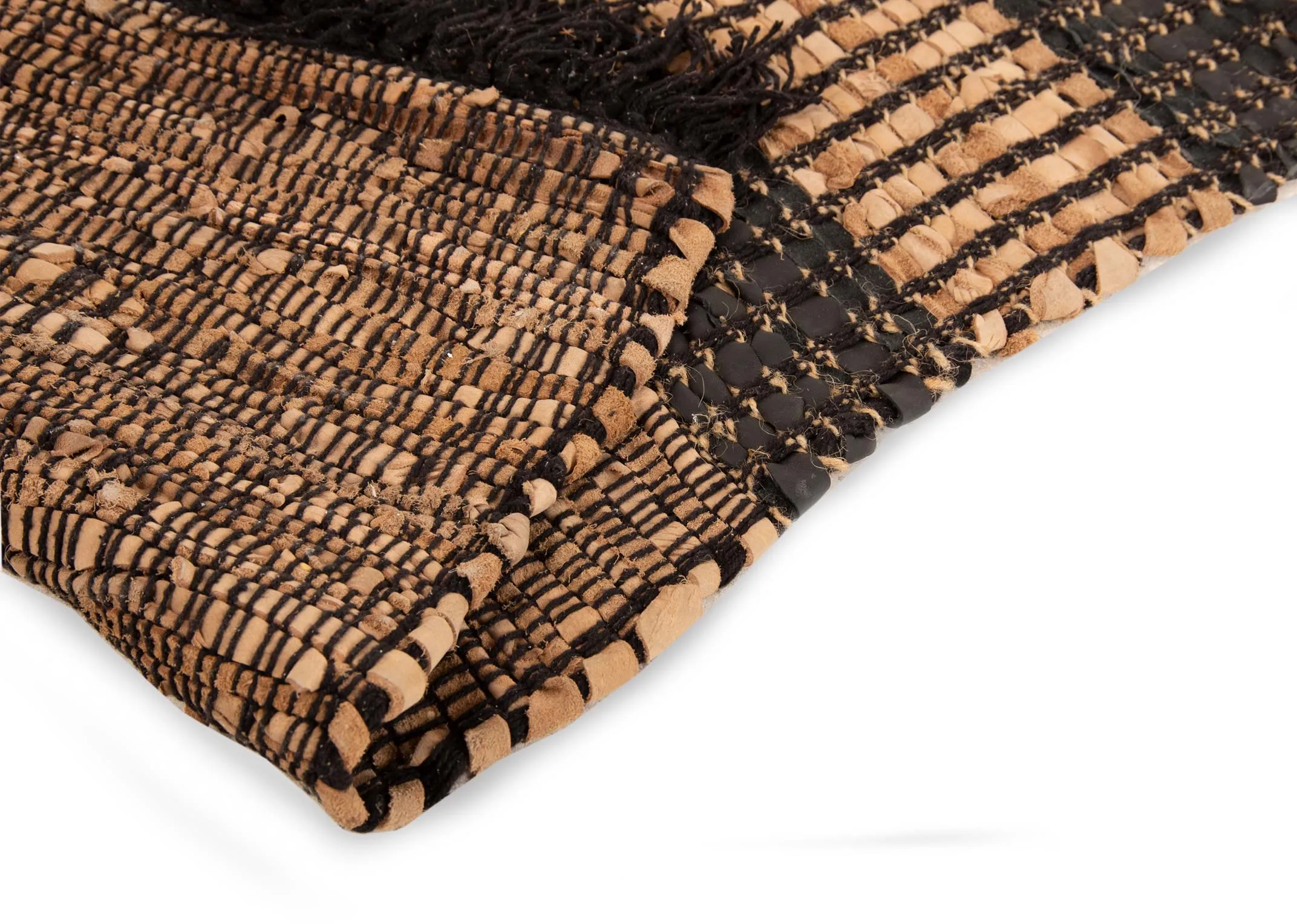 A brown & black stripped medium woven rug from EZ Livings Vagium range. Closeup pf underlay