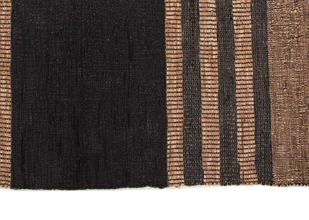 A brown & black stripped medium woven rug from EZ Livings Vagium range. Closeup pf pattern