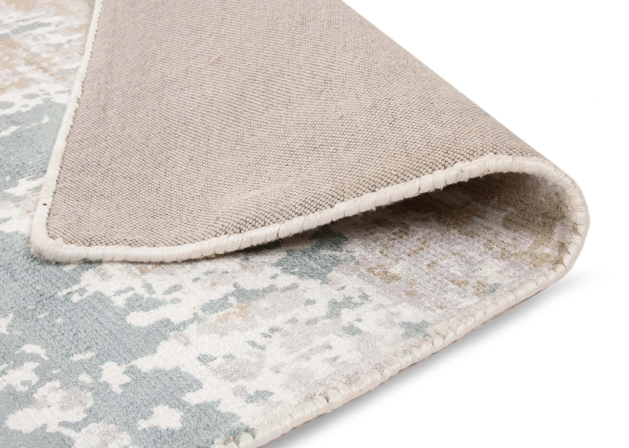An ivory grey distressed medium rug from EZ Living's Modesto range. Underlay image of rug