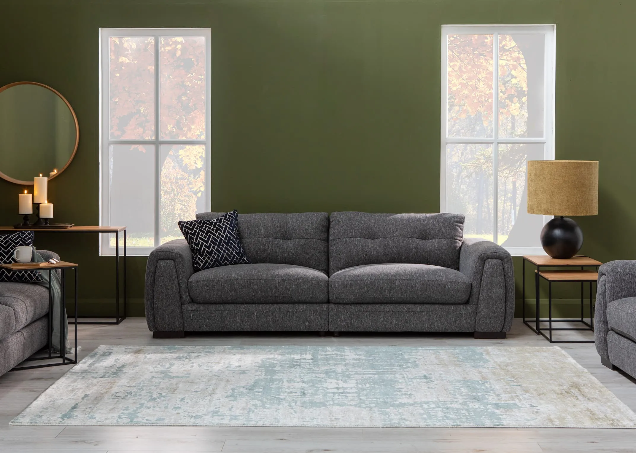 A lifestyle image of the Cliff Sofa range with aston tables & modesto grey rug