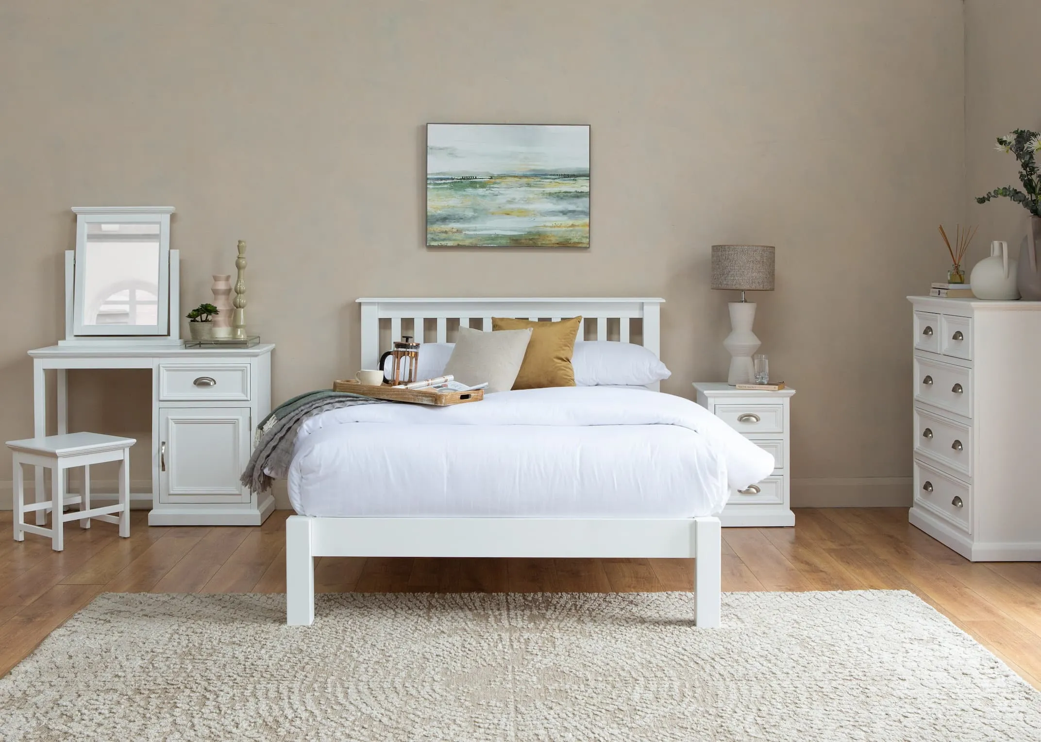 A lifestyle image of the Malmo bedroom range with milton rug and western glow canvas
