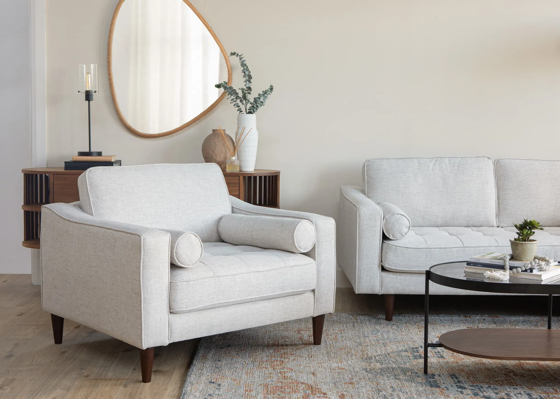 A lifestyle image of the Genoa armchair with Cody mirror & recap sideboard