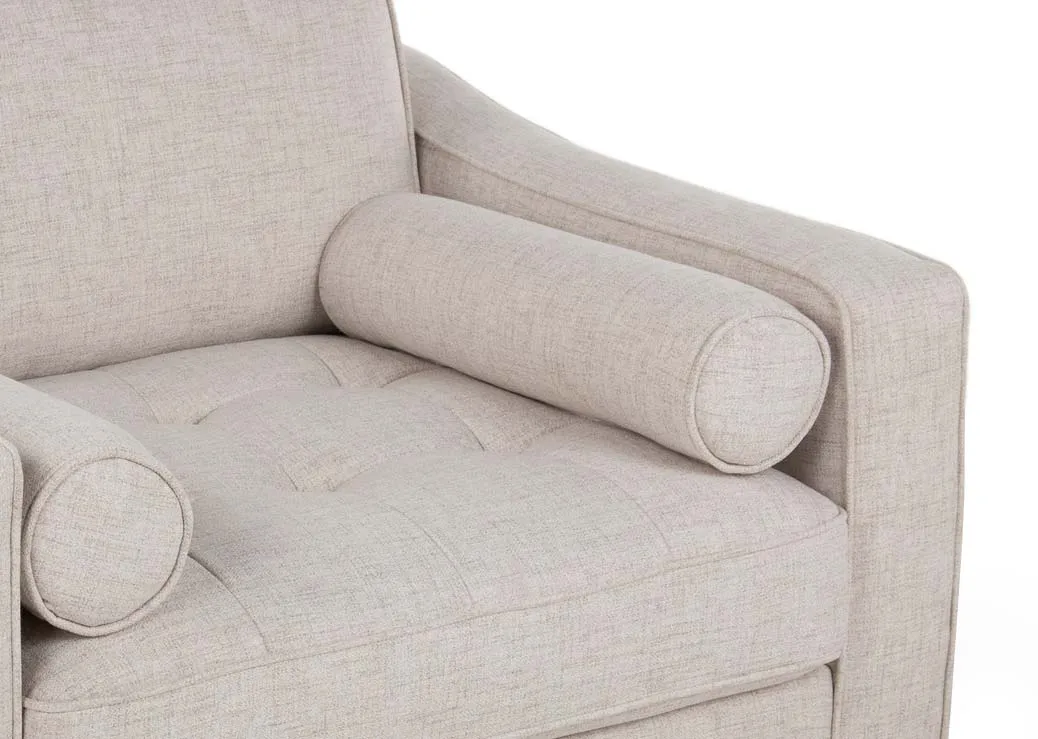 A cream fabric armchair with dark legs from EZ Living Furniture's Genoa range. Closeup pf bolster & tufted detail