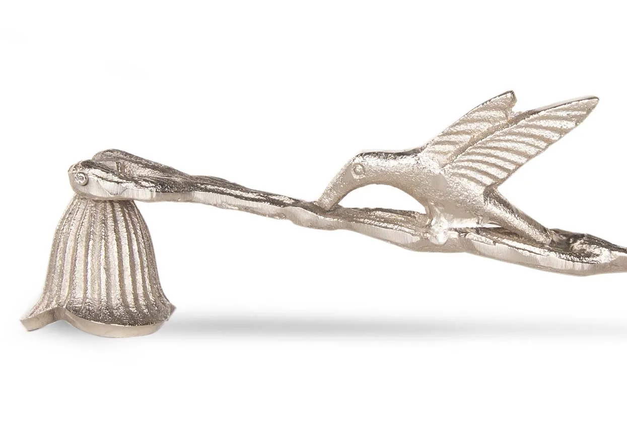 A silver nickle candle snuffer from EZ Living Furniture's Christmas range. Closeup of bell snuffer.