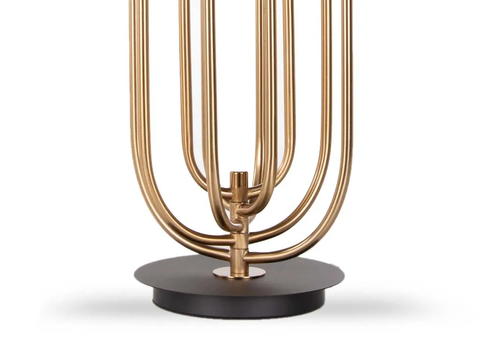 A gold metal art deco table lamp with black hard shade from EZ Living's Dixie range. Closeup view of black base & gold metal