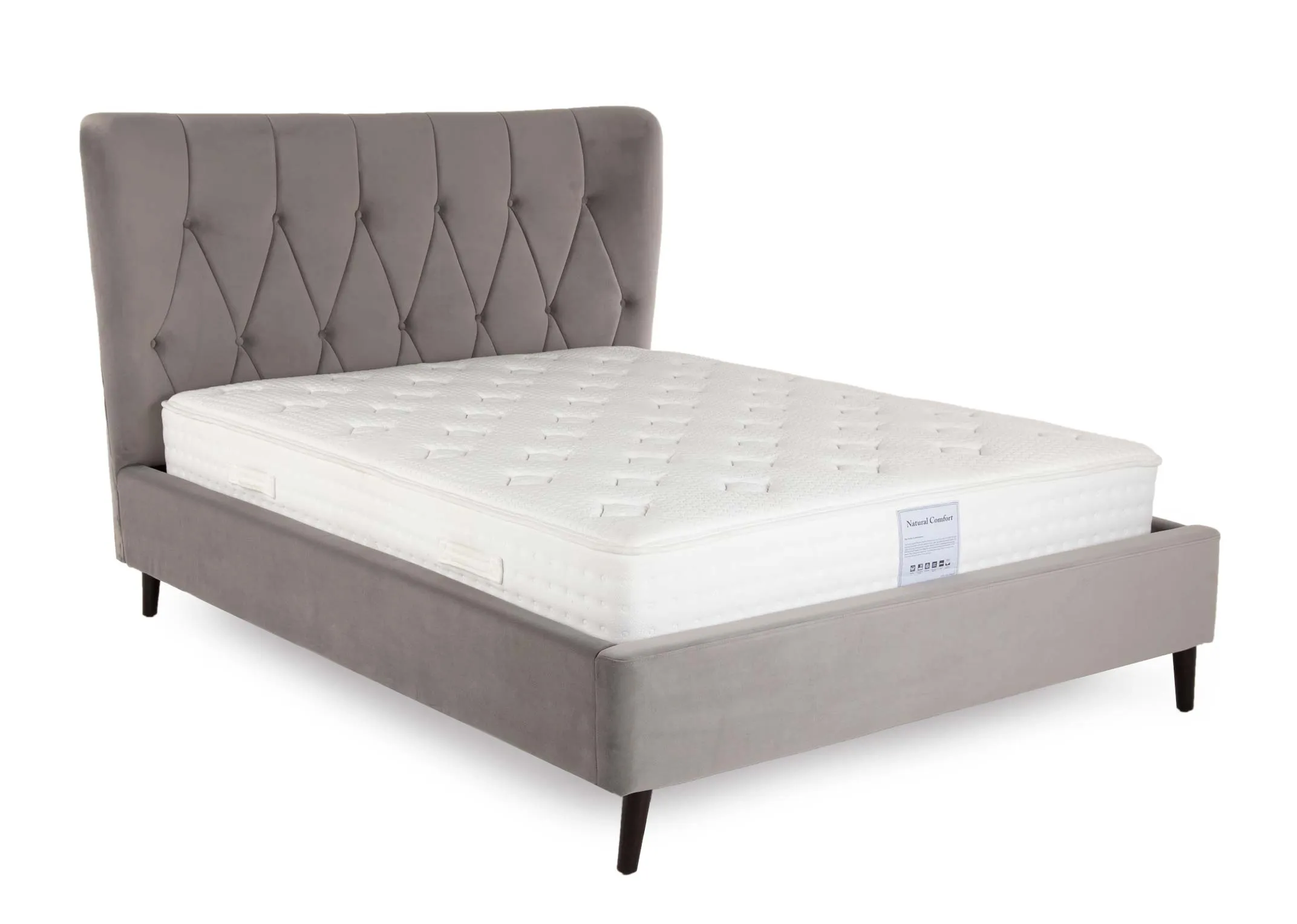 A 4ft 6 silver velvet bedframe with mattress from EZ Living Furniture's Garcia range. Angled view of velvet trim base.