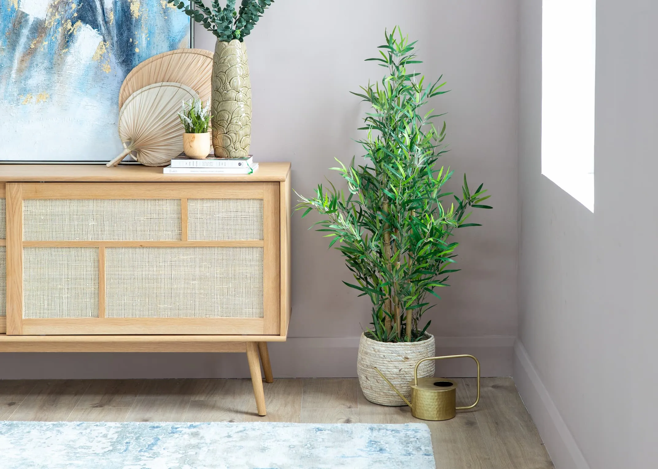 A lifestyle image of the Bamboo tree with basket & barrali sideboard