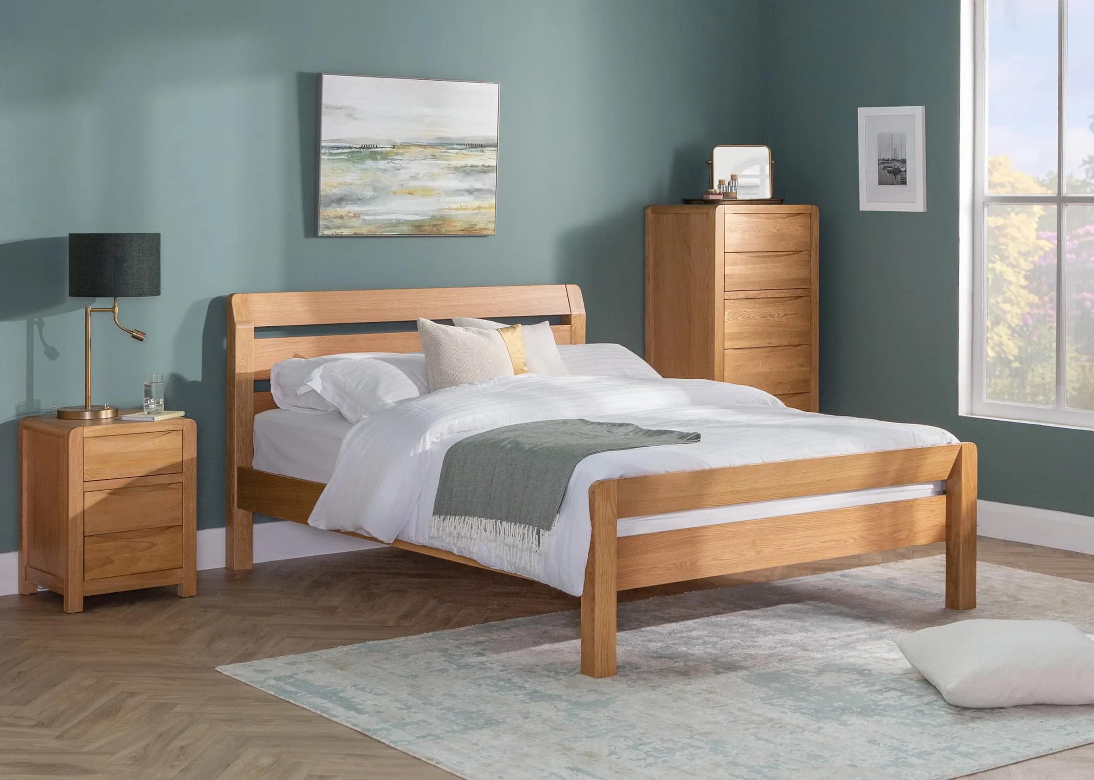 A lifestyle image of the King Size Iris bedframe with tallboy & locker with western Glow canvas & calgary lamp