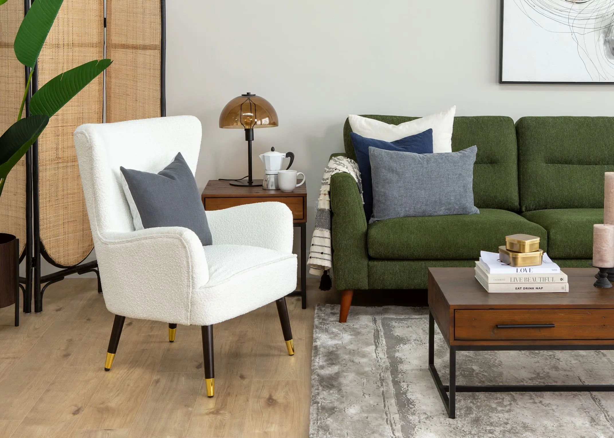 A lifestyle image of the Shiraz lounge chair with Presley green sofa with Chicago coffee table