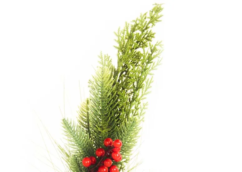 A green leafy pick with pine cone and red berries from the EZ Living Christmas range. Closeup of leafy foliage