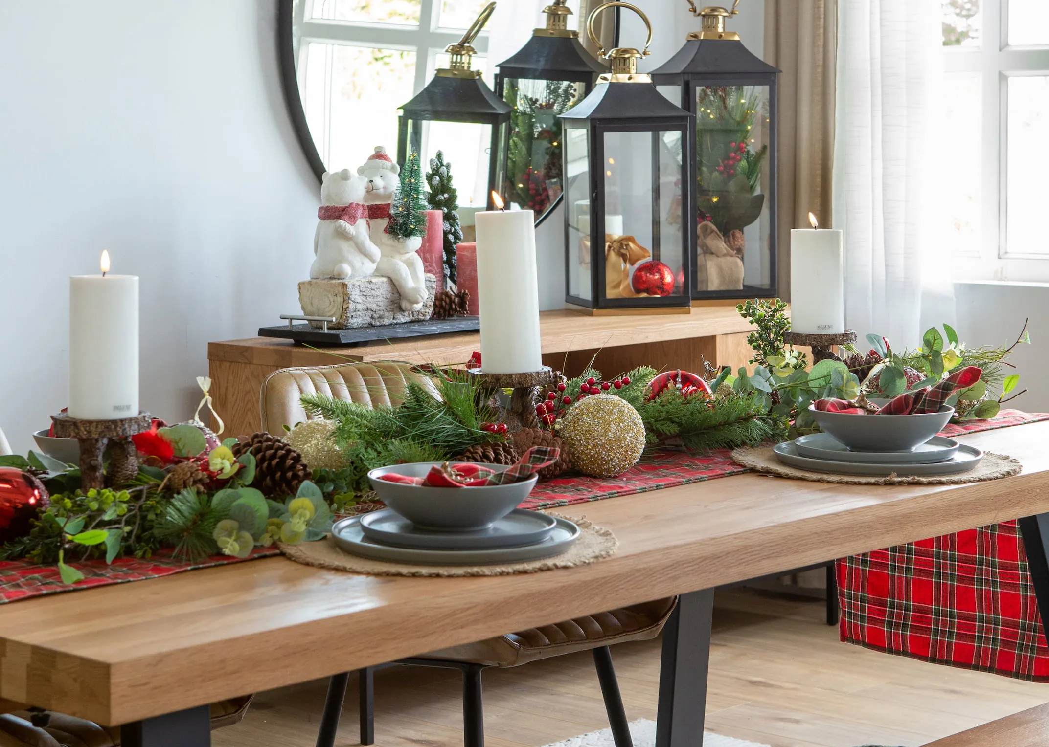 A small pine cone & berry artificial tree in a burlap sack from EZ Livings Christmas range. Front view