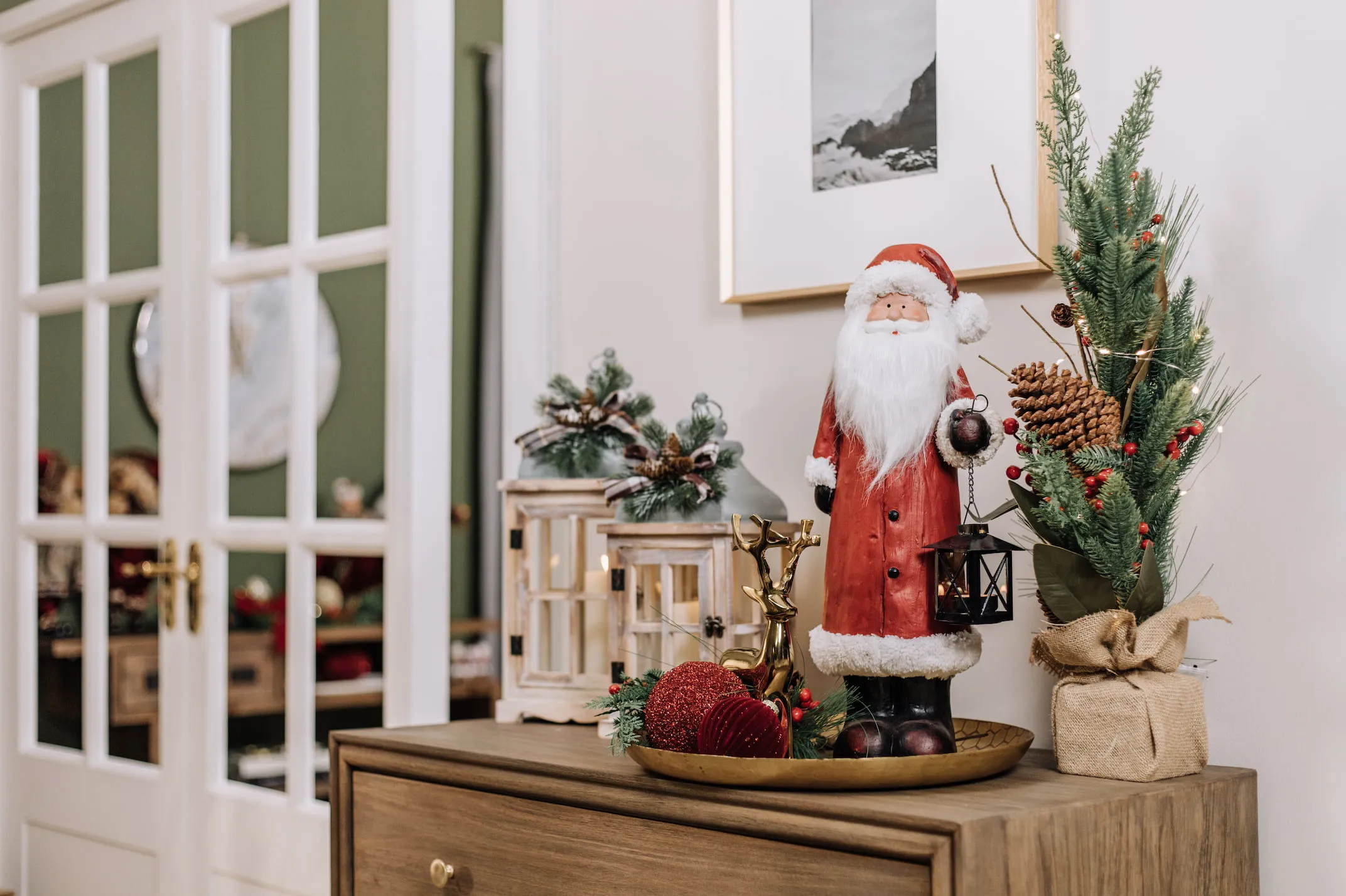 A lifetsyle image of a sideboard with wooden lanterns