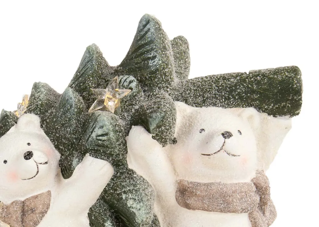 An ornament of three white bears varying in size carrying a tree from the EZ Livings Christmas range. Closeup of bears