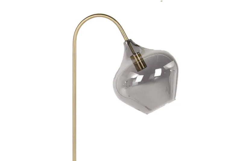An antique bronze floor lamp with glass shade from EZ Living Furniture's Rakel range. Closeup of smoked glass pendant