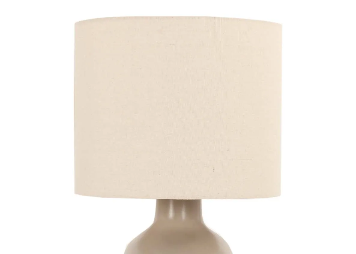 A taupe ceramic table lamp with cream shade from EZ Livings Retro range. Closeup of cream barrel shade