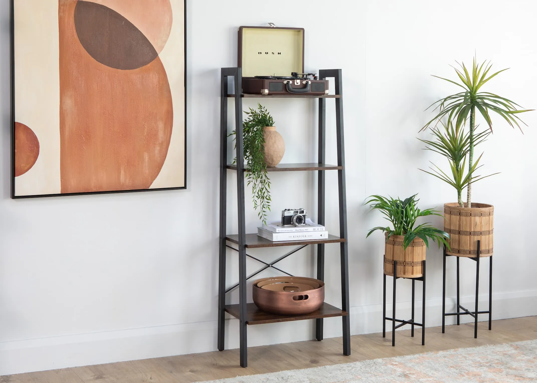 A lifestyle image of the Karo ladder shelf with Bowls and books
