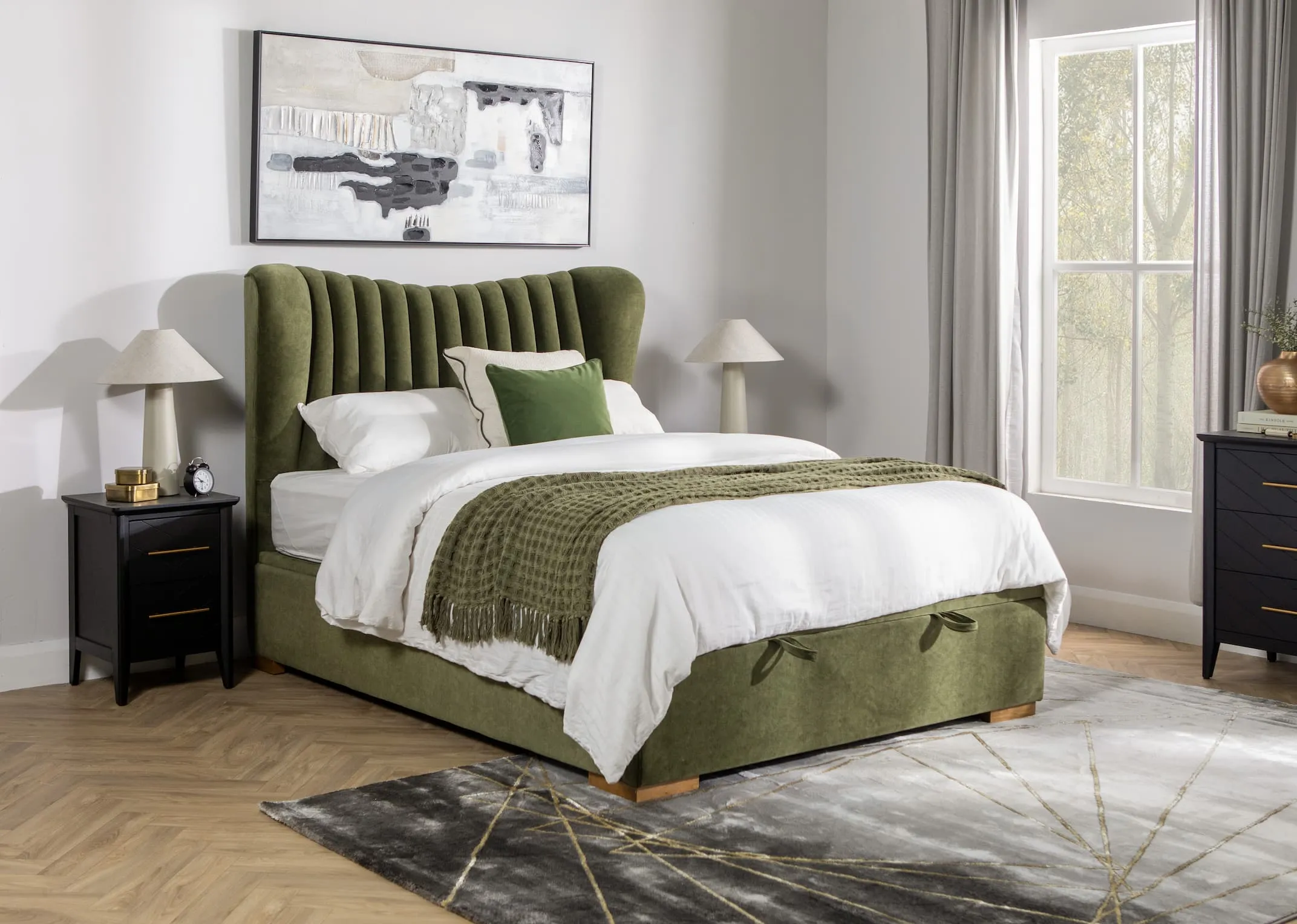 A lifestyle image of the Robin green ottoman with chevron black locker and avery rug