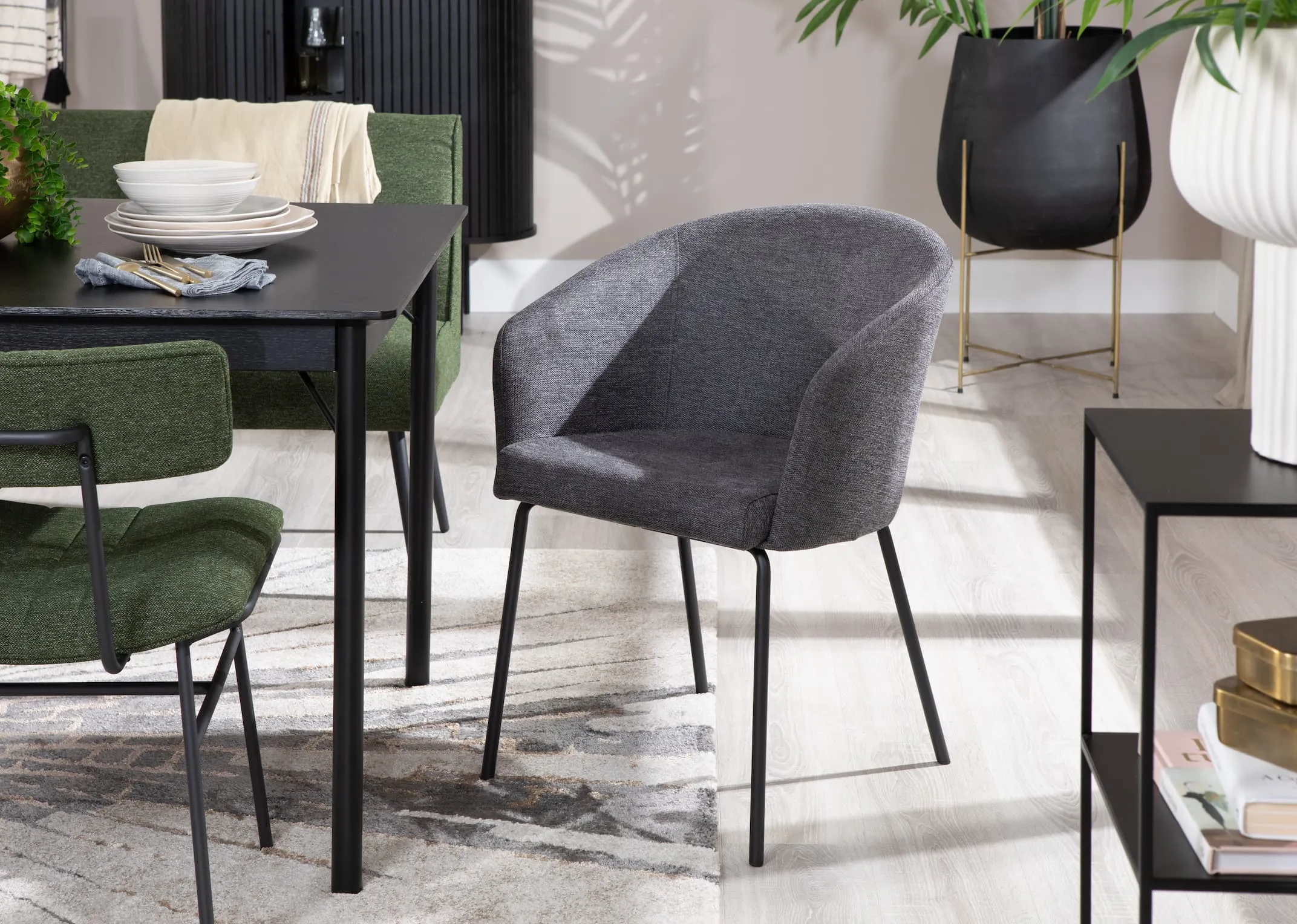 A lifestyle image of the Easton dining chair with the Savonnah rectangular dining table & Aruba rug