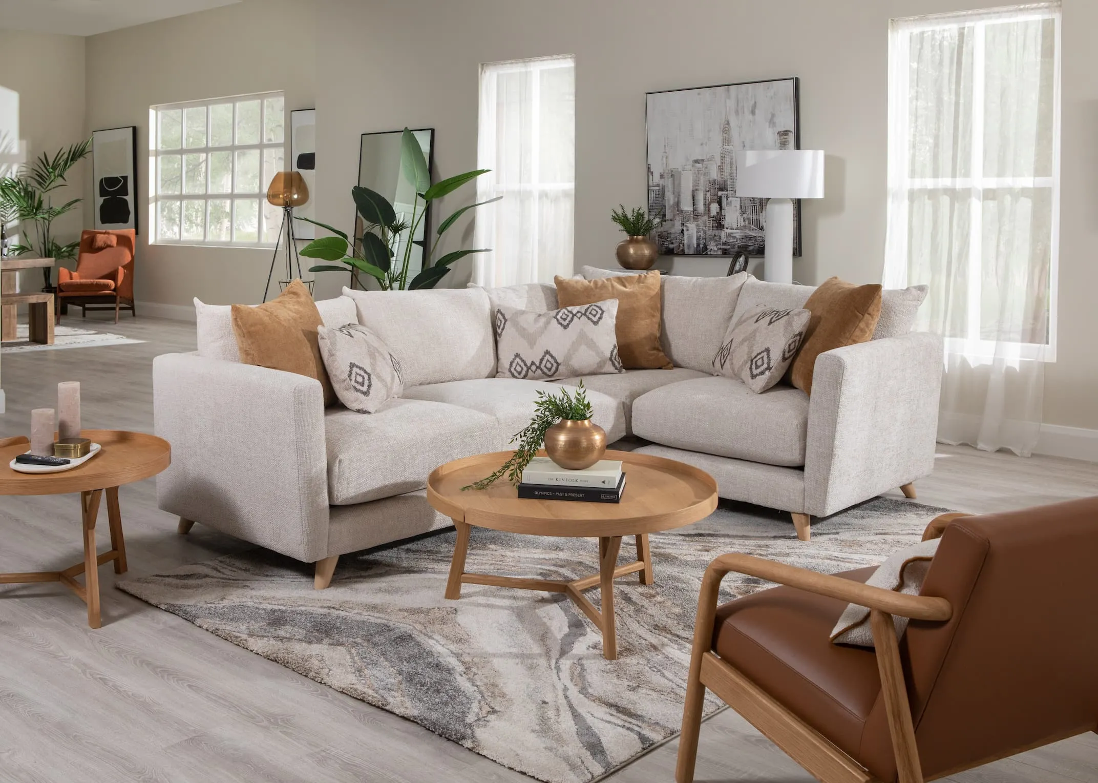 A lifetsyle image of the Trieste Coffee table as side with the Ponti corner sofa