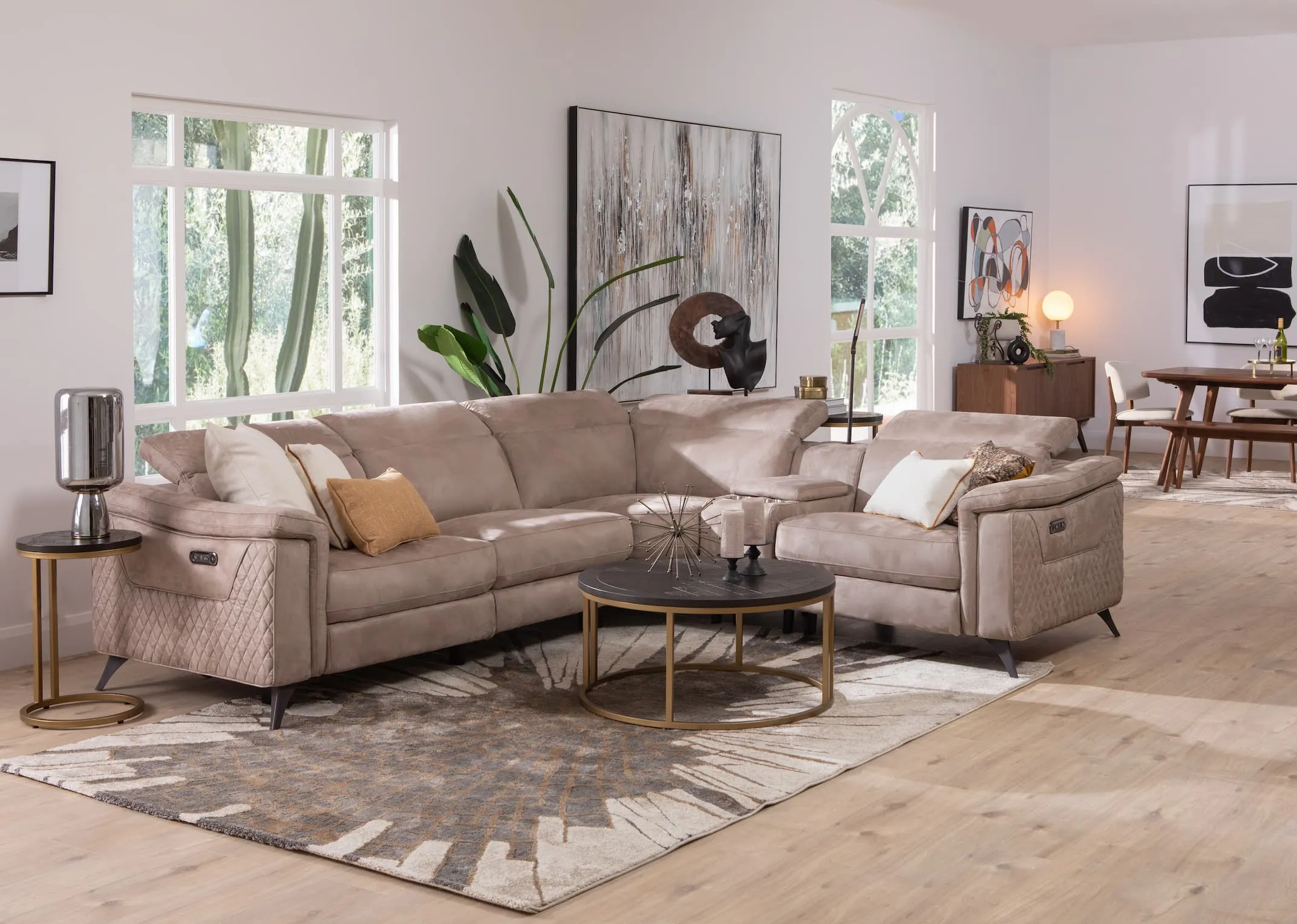 A grey fabric power reclining corner sofa from EZ Livings Bellissino range. Closeup of drinks holder in armrest in end power recliner