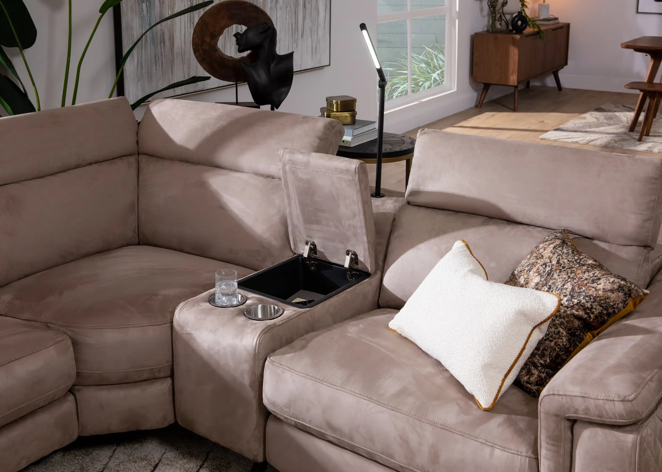 A grey fabric power reclining corner sofa from EZ Livings Bellissino range. Closeup of overhead light