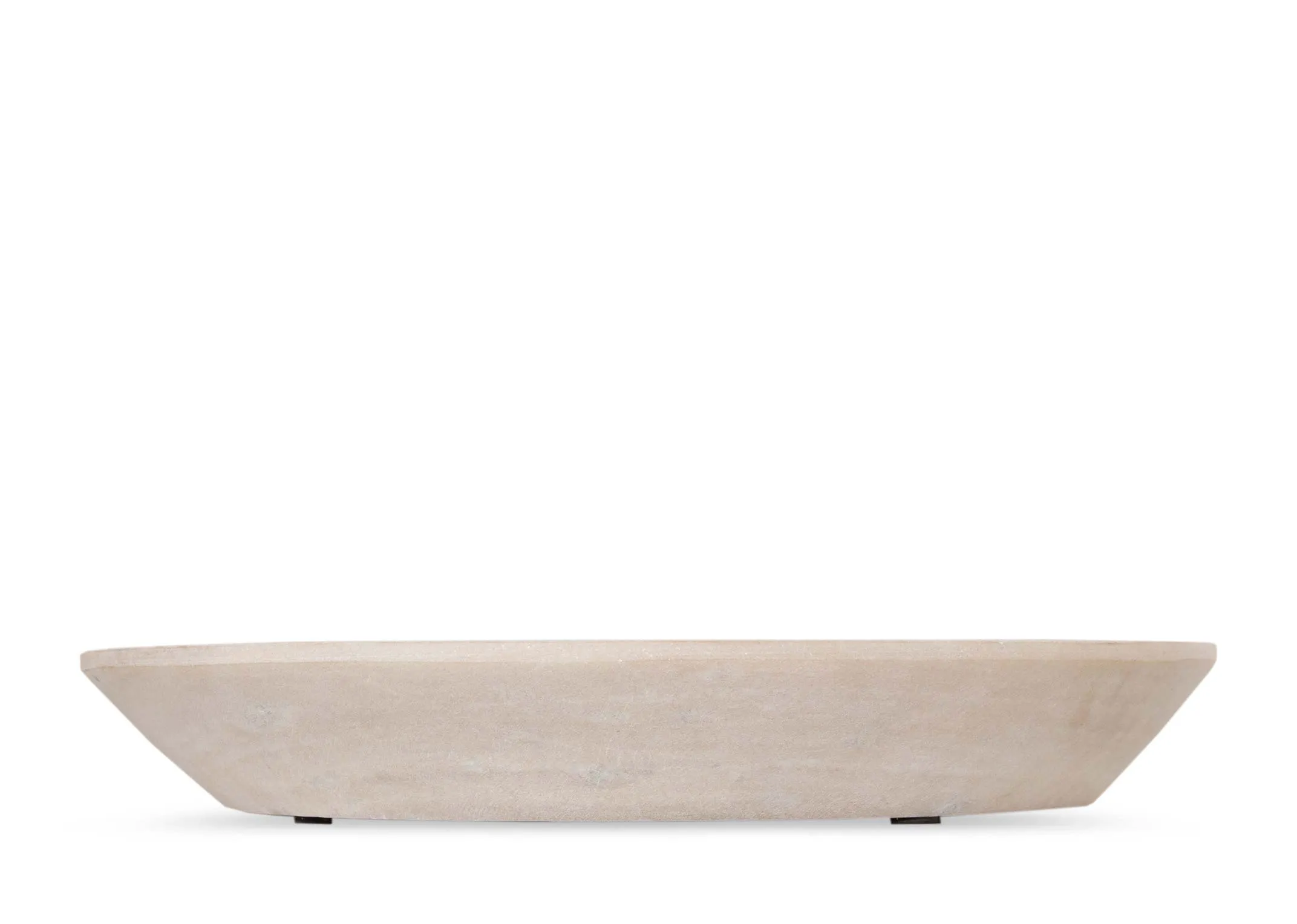 A lifestyle image of the Catalan coffe table with the Couzana dish and candles