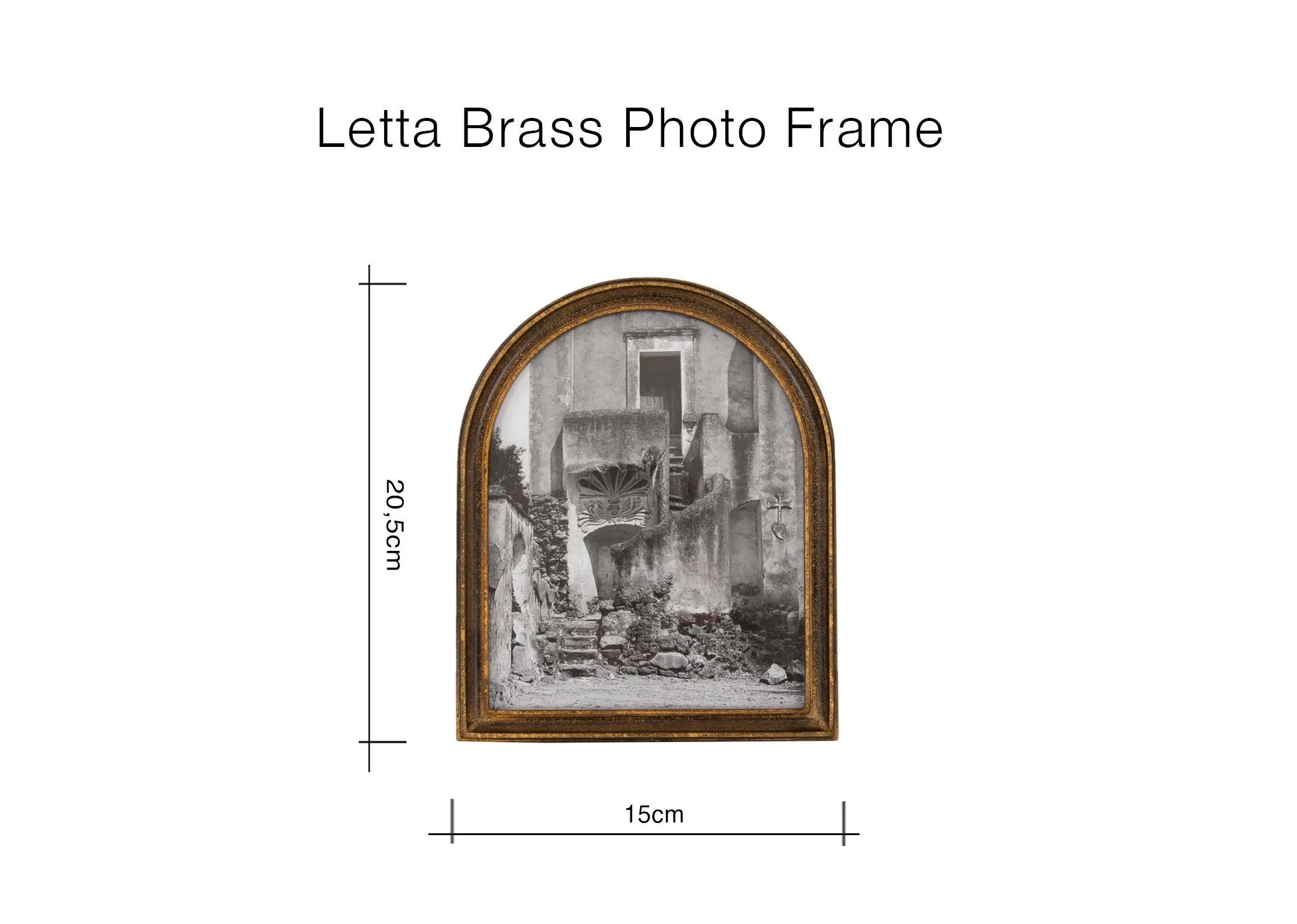 A lifestyle image of the Letta photo frames in brass and black on books on a mantle.