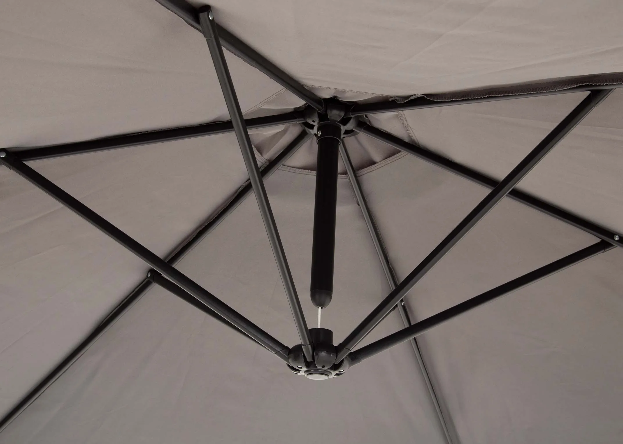A large grey hangining outdoor parasol attached to base from EZ Livings Murcia range. Closeup of spokes