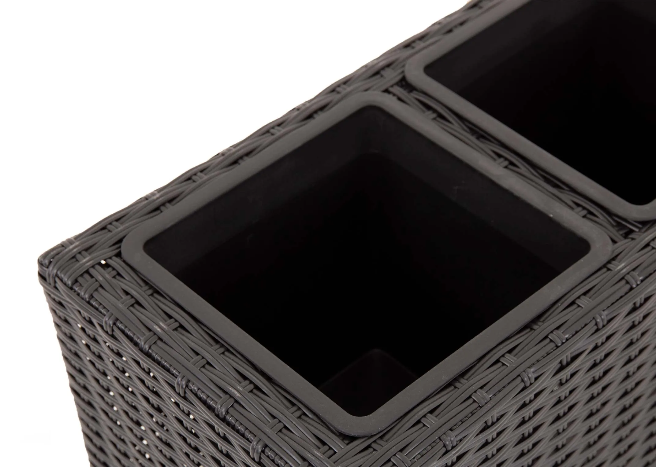 A 4 pot black wicker planter from EZ Livings Cadiz range. Closeup of black plastic pot inserts