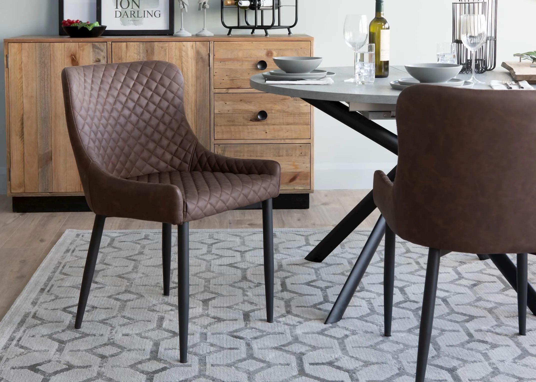 A lifestyle image of the San Francisco sideboard & giove table with Vintage Brown ottowa chair.