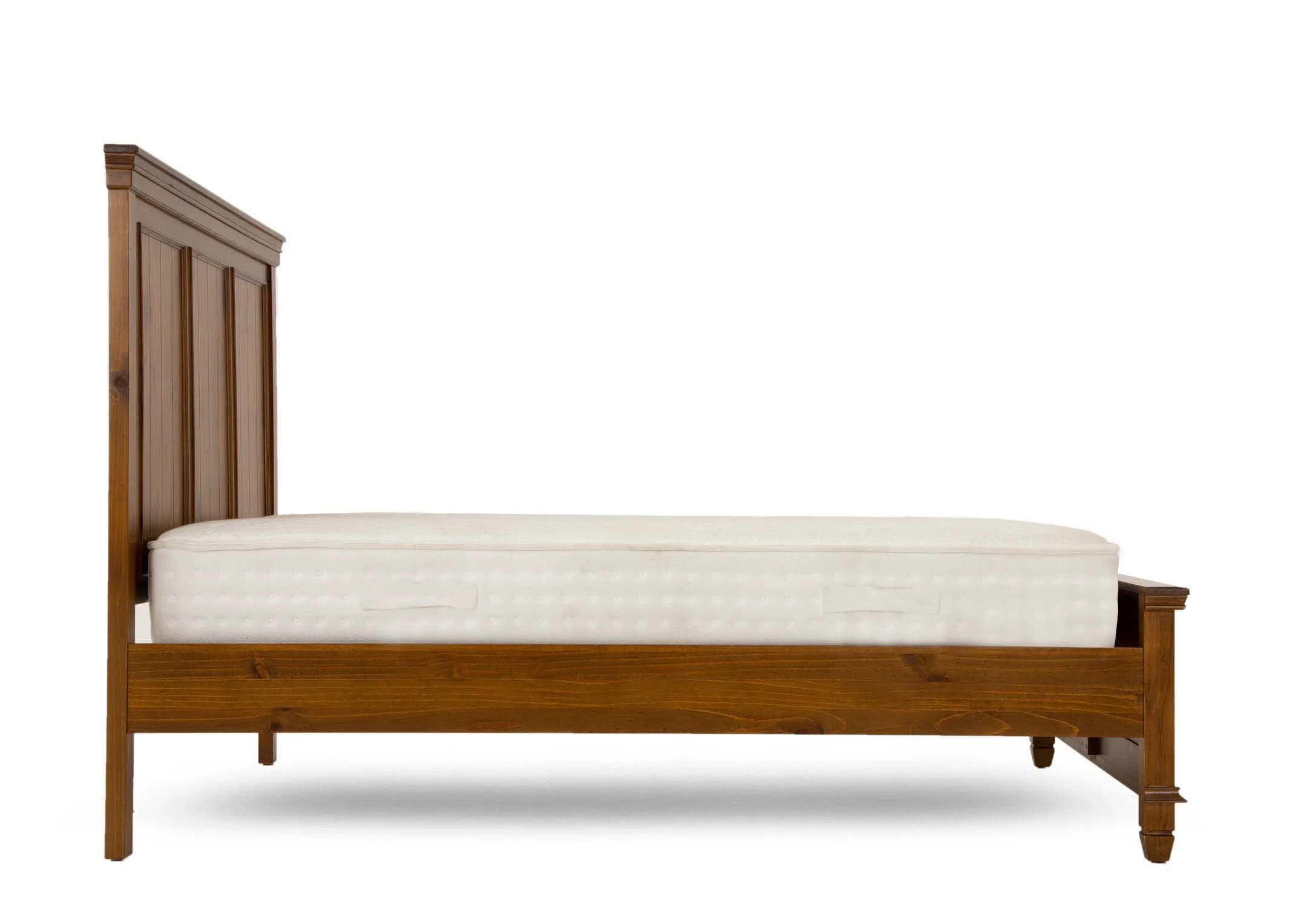 A glossy pine 4ft 6 bedframe with high headboard and footboard from EZ Livings Allyson range. Side view of high feet and space beneath bed