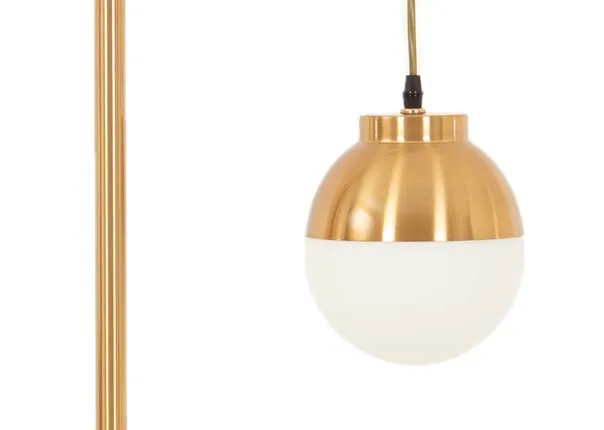 A gold arc metal table lamp from EZ Livings Casper range. Closeup of gold fittings and white globe