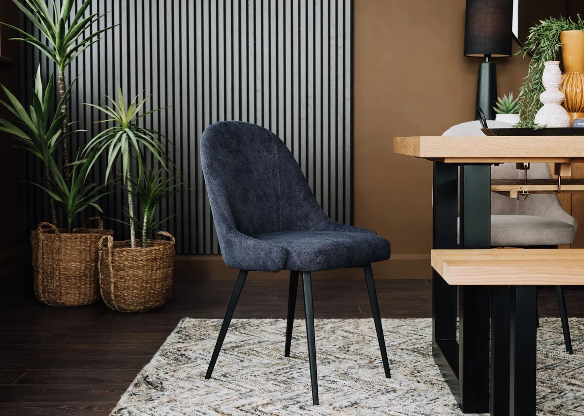 A lifestyle image of the Jacob dining chair with Montana dining table with Savannah rug.