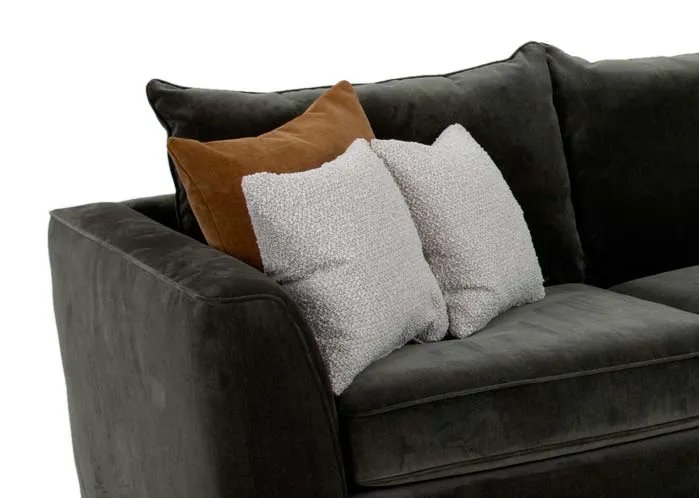 A khaki green fabric corner sofa from EZ Livings Lucius range. Closeup of 2 white textured cushions.