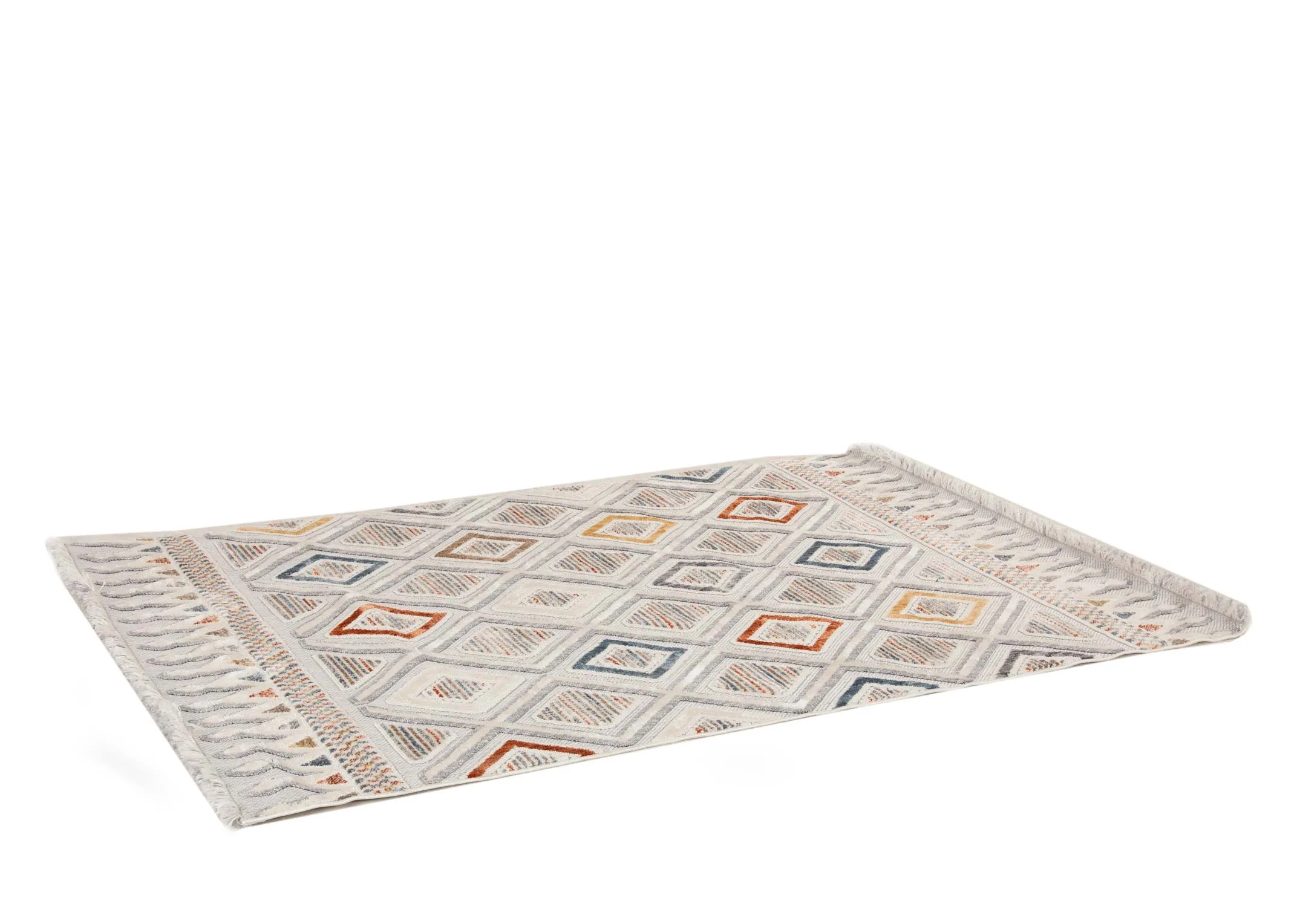 A white medium rug with red gold yellow and blue geometric design from EZ Livings Holiday range. Angled view of short pile rug