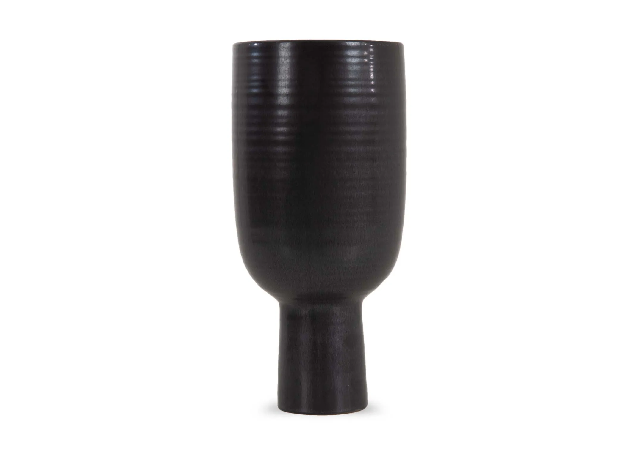 A slim matt black vase with long base from EZ Livings Shalwa range. Front view